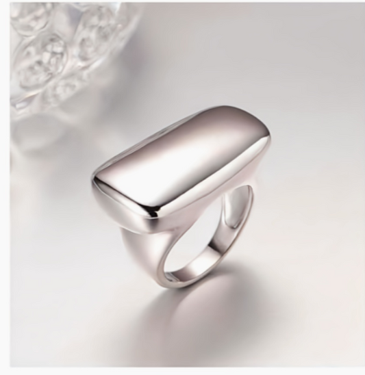 Silver ring on a light gray background