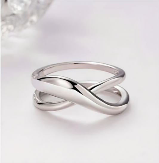 Silver ring with a unique design on a white background